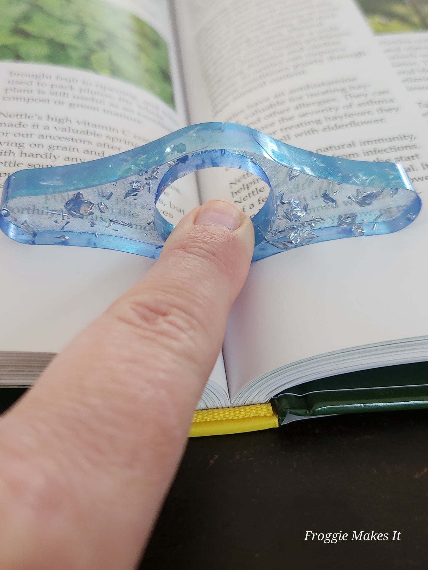 Thumb grip book page holder