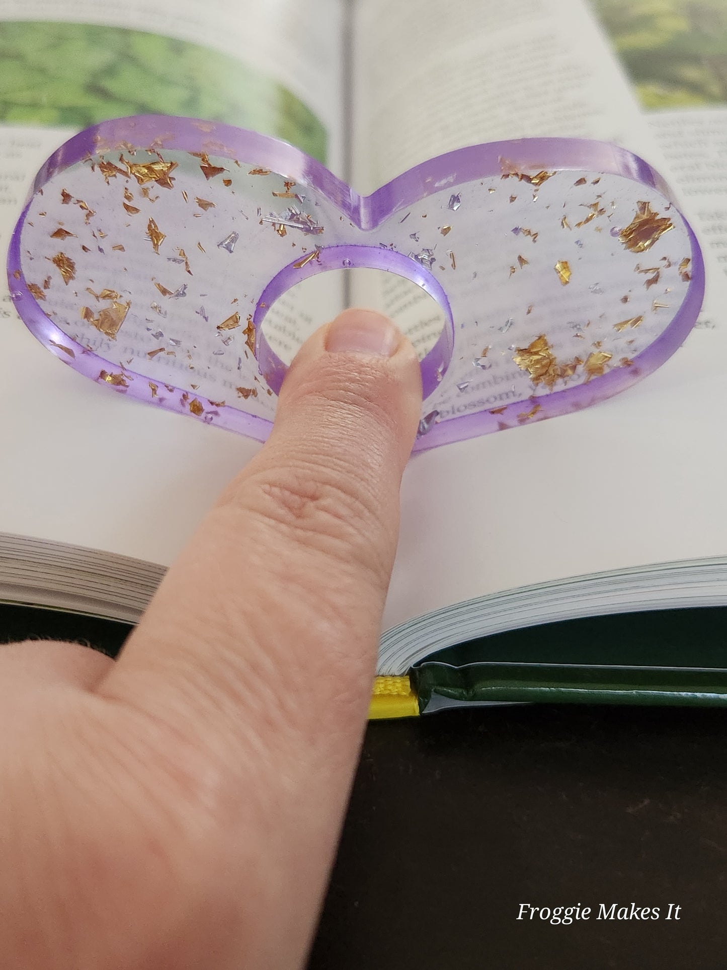 Thumb grip book page holder