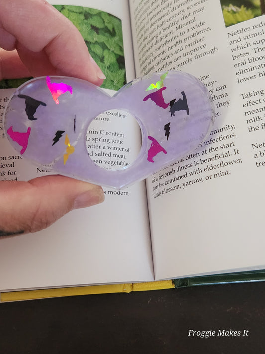 Thumb grip book page holder